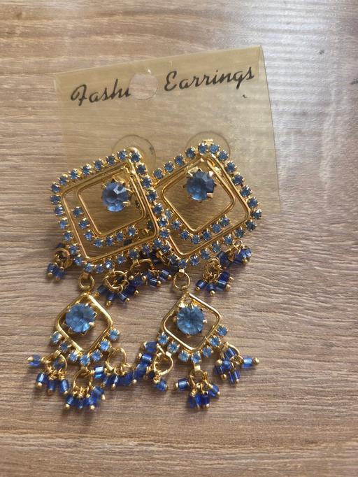  — blue and gold earrings
