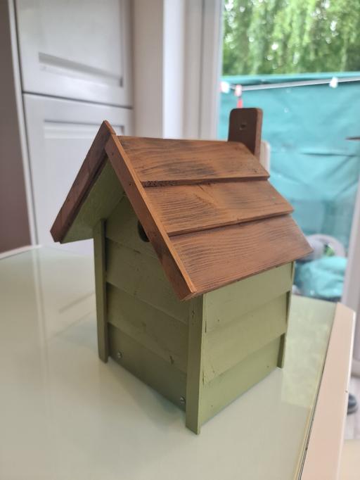  — hand-made birdhouse.