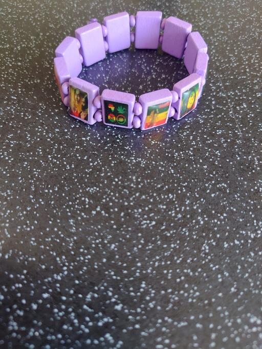  — Purple rasta wrist band
