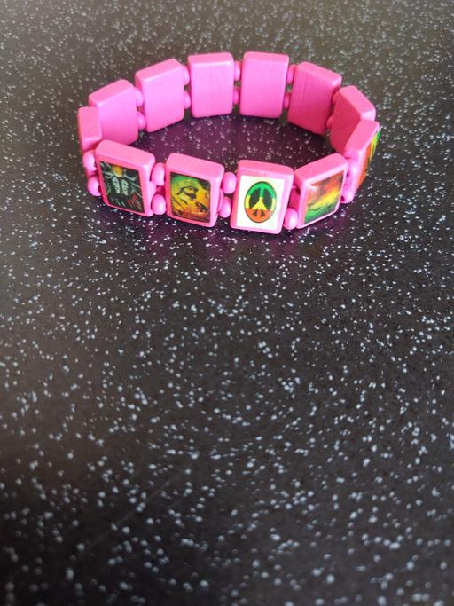  — Pink rasta wrist band
