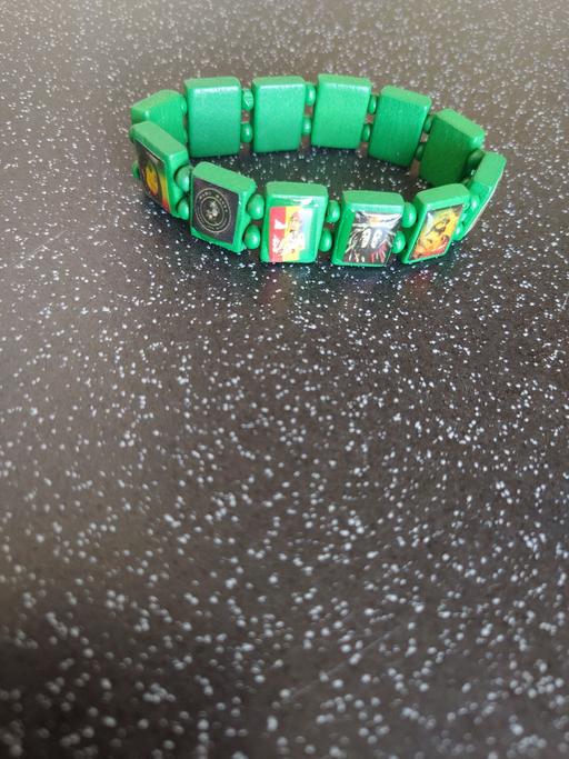  — Green rasta wrist band