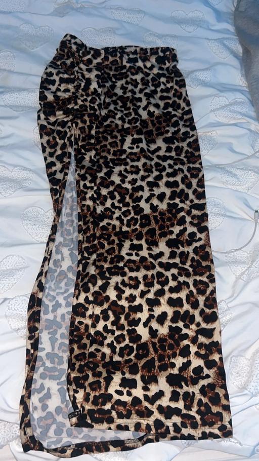  — Leapord print skirt with leg slit