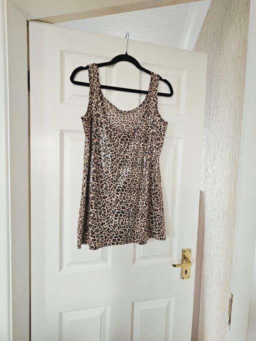  — Sequin animal pattern top, size 16..NEW