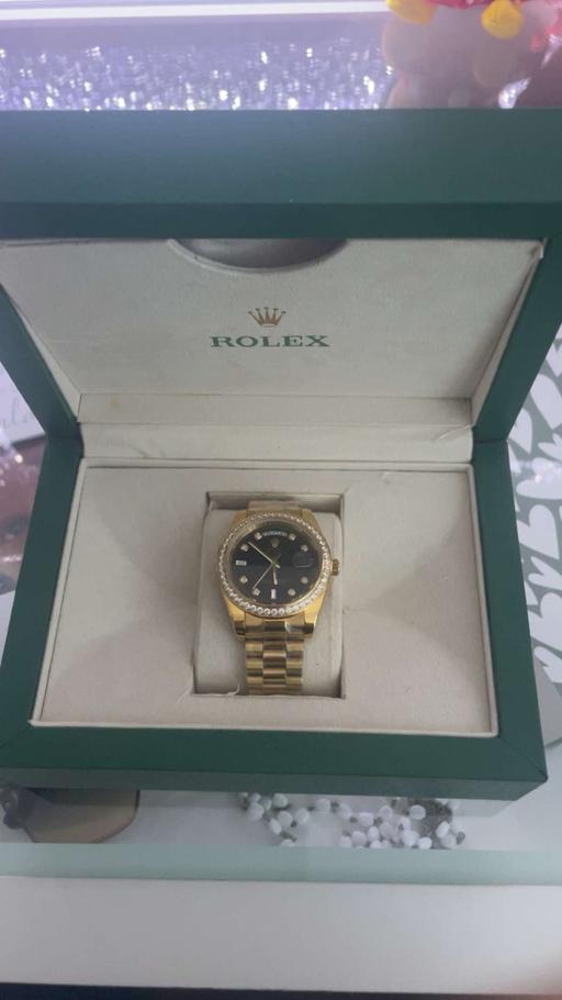  — Gold watch