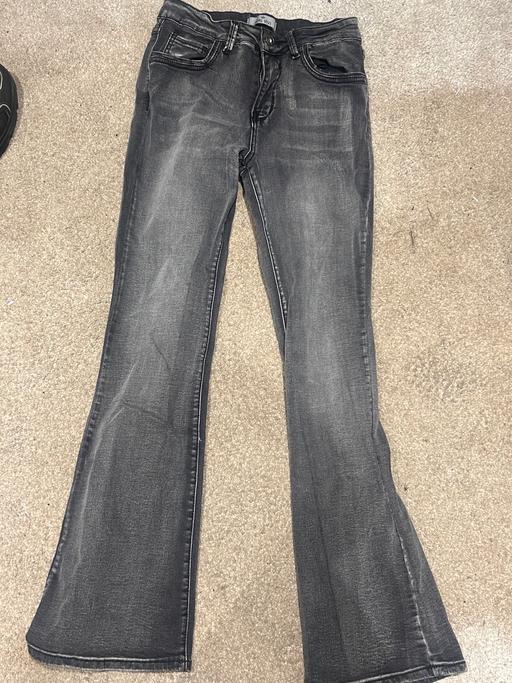  — Grey flared jeans