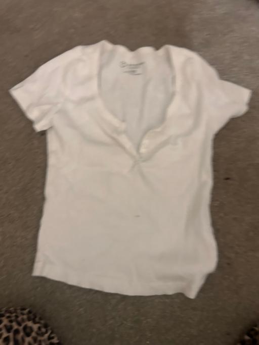  — White button up top