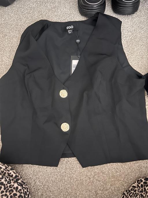  — Button up top