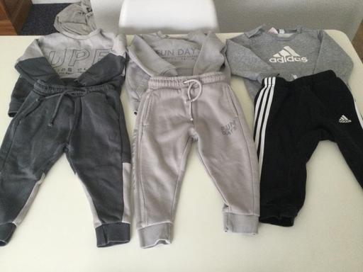  — 3 tracksuits age 12/18 months