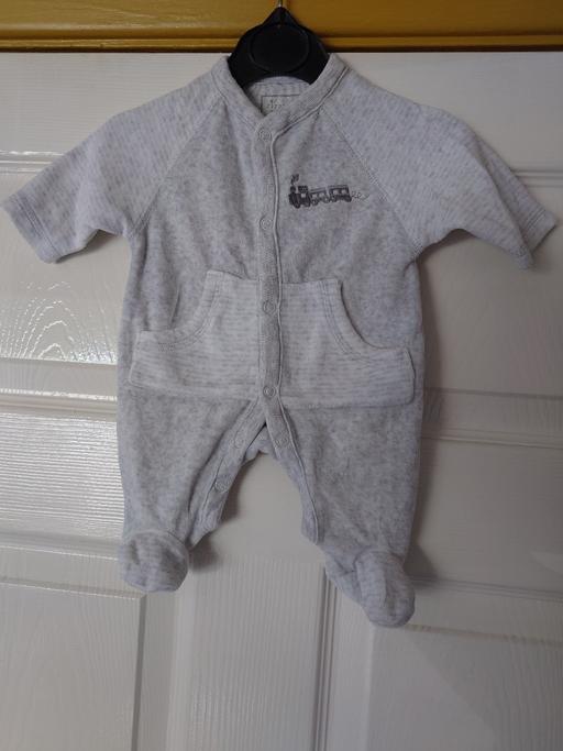  — Baby boys grey sleepsuit size first size