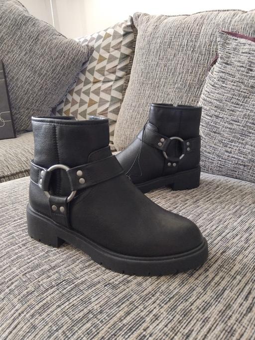  — Black boots