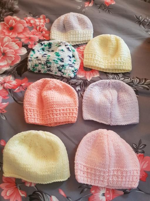  — 7 new baby hand knitted hats