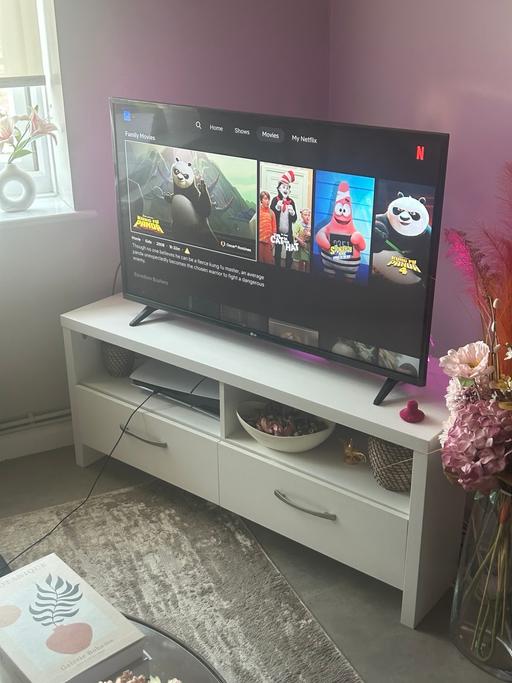  — LG 43 inches smart TV and white TV stand