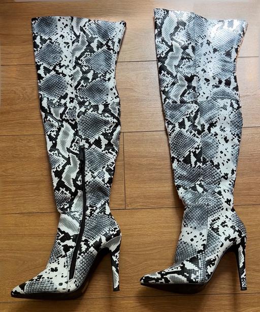  — Snake print over the knee heeled boots