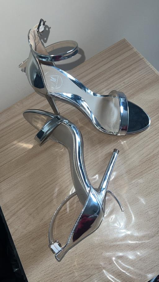  — Silver mirror heels