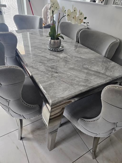  — SOLID MARBLE DINING TABLE WITH 6 WINGED CHAIR