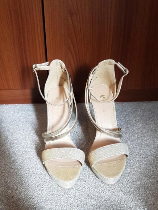  — Gold strappy heels