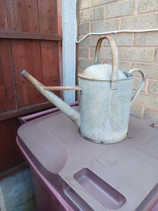  — metal watering can garden ornament