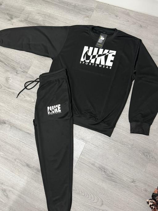  — Black Nike tracksuit