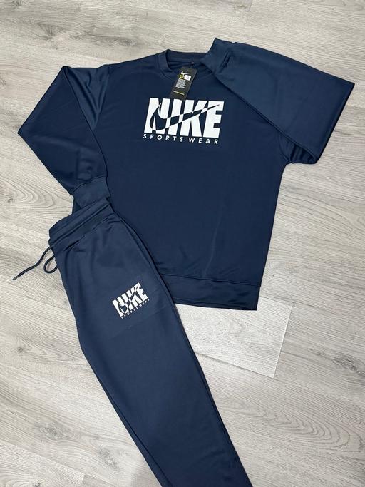  — Blue Nike tracksuit