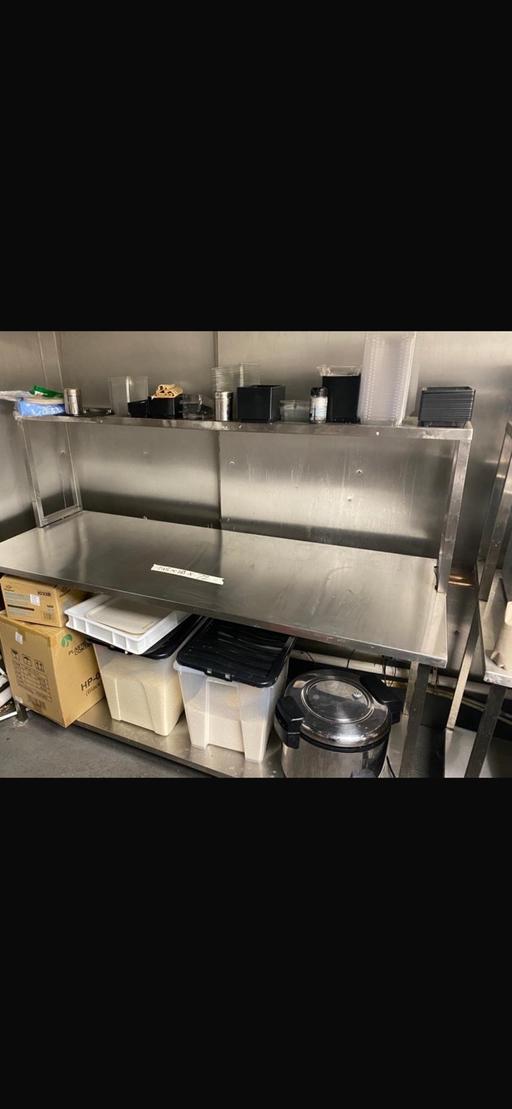  — Stainless steel table with shelf many ava