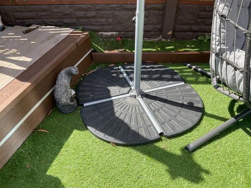  — Egg chair and umbrella with weights 