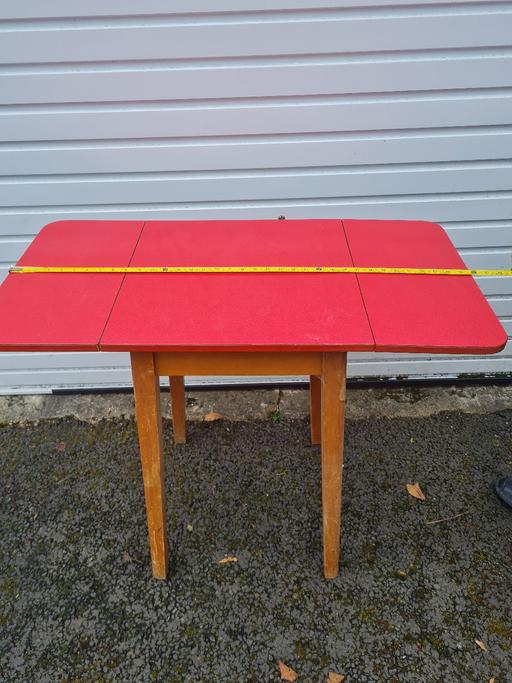  — VINTAGE RED FORMICA TABLE WITH WOODEN LEGS