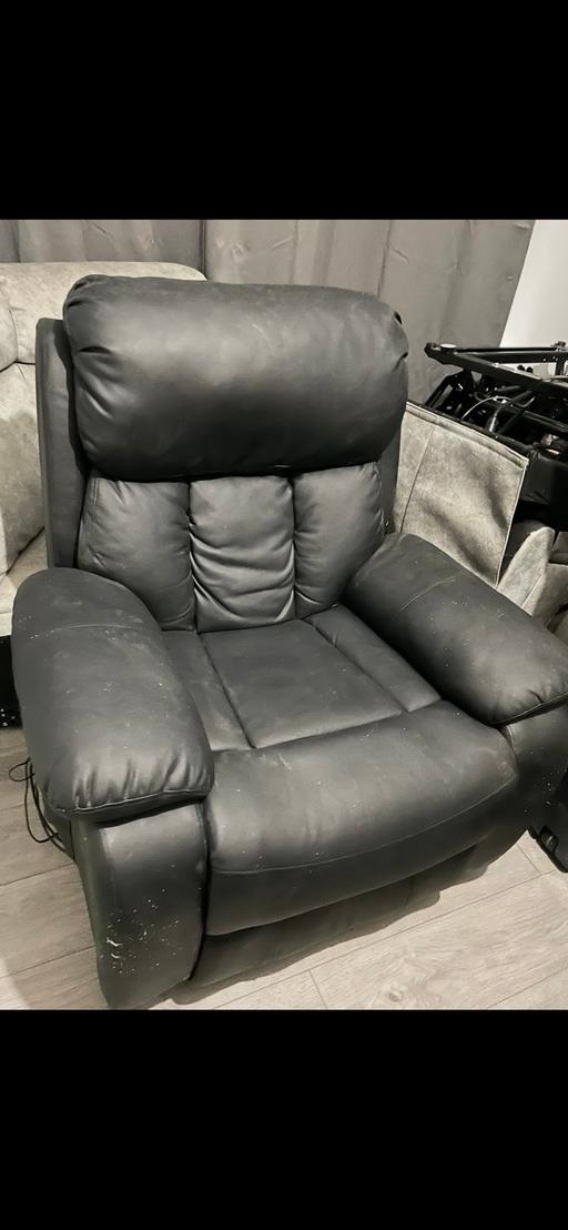  — Black leather riser recliner