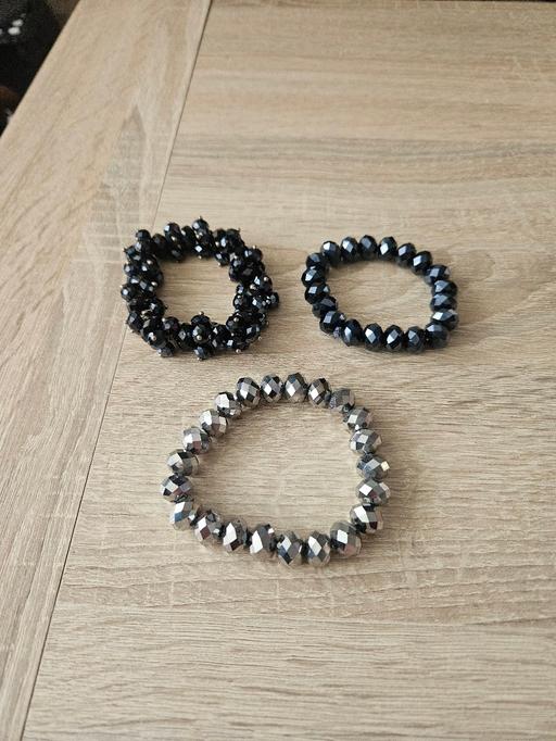  — 3 shimmer bracelets.