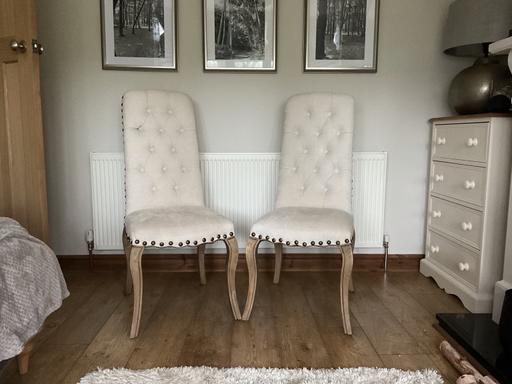  — Two cream chenille dining chairs