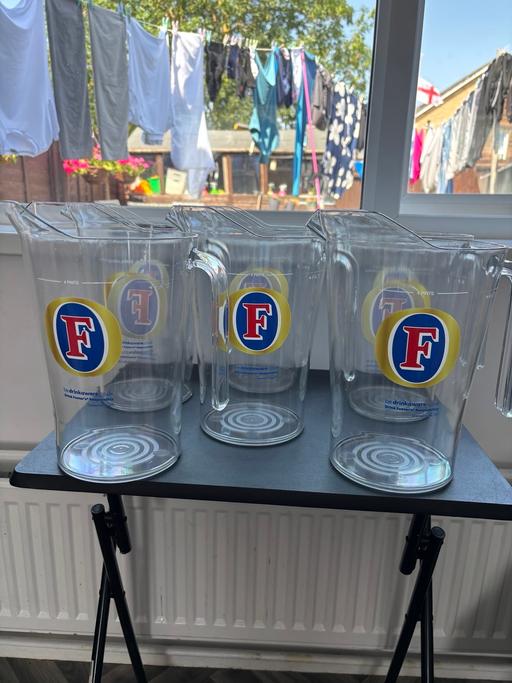  — SIX FOUR PINT FOSTERS JUGS