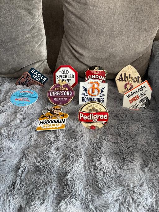  — A COLLECTION OF METAL BEER PUMP TAGS