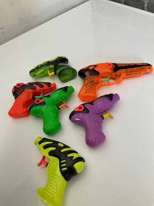  — water guns