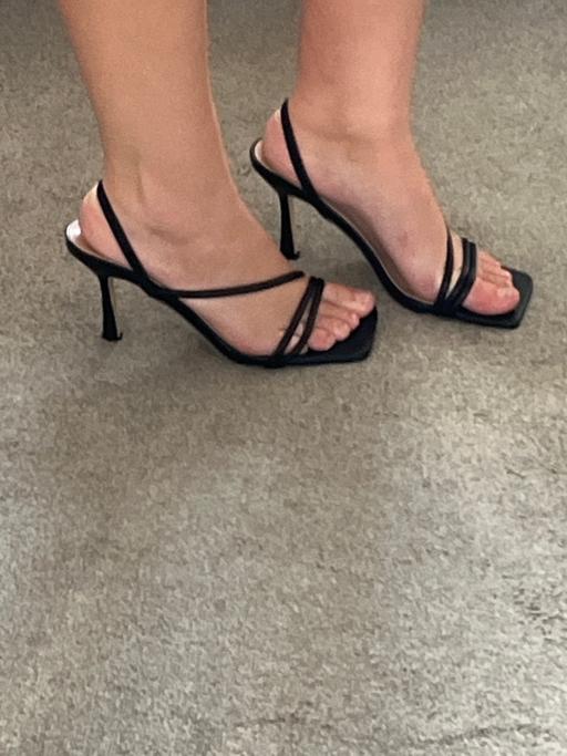  — Black heels