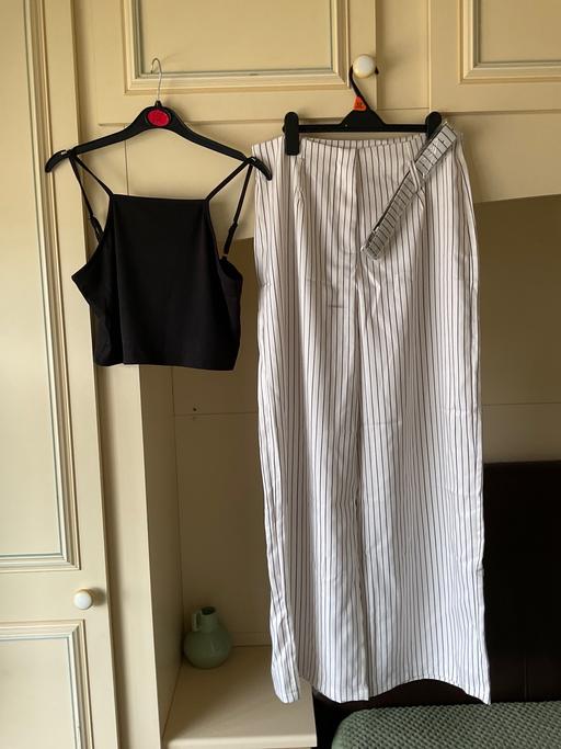 — Trousers and top