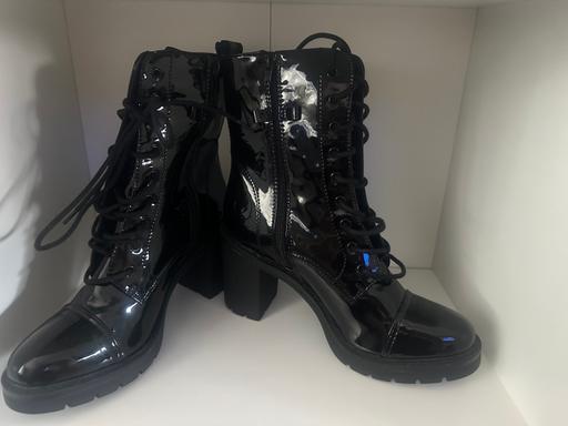  — New ladies boots in size 7.