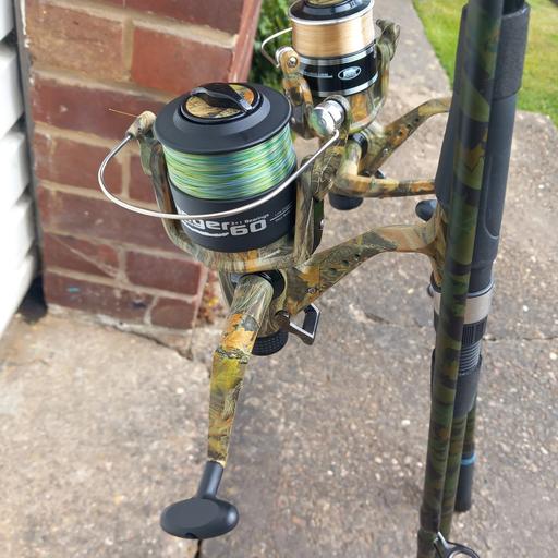  — 2 Camo 12ft rods and reels,never used