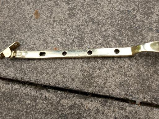  — Brass window closer