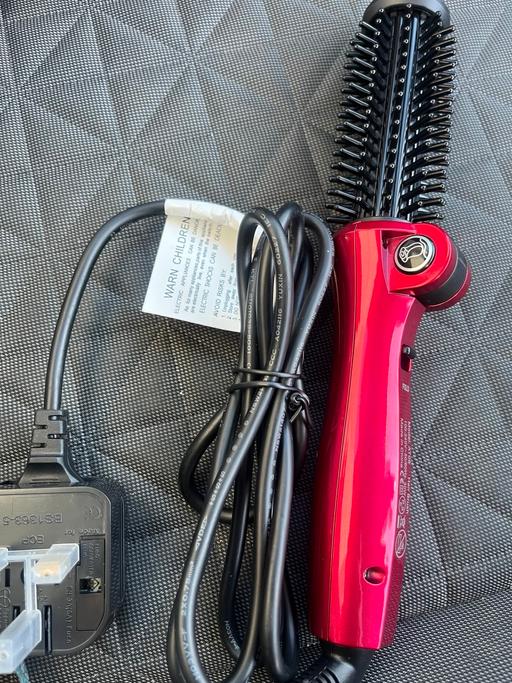  — Travel folding curling iron
