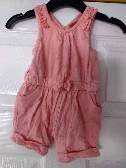  — Baby girls pink playsuit size up to 1 month