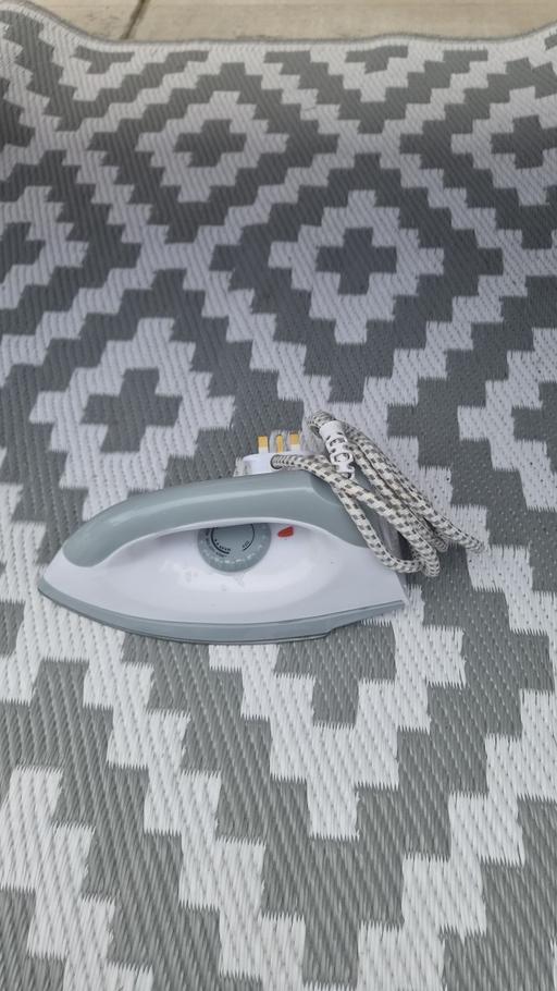  — travel iron