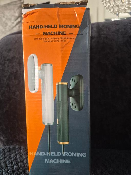 — NEW HAND HELD IRONING MACHINE
