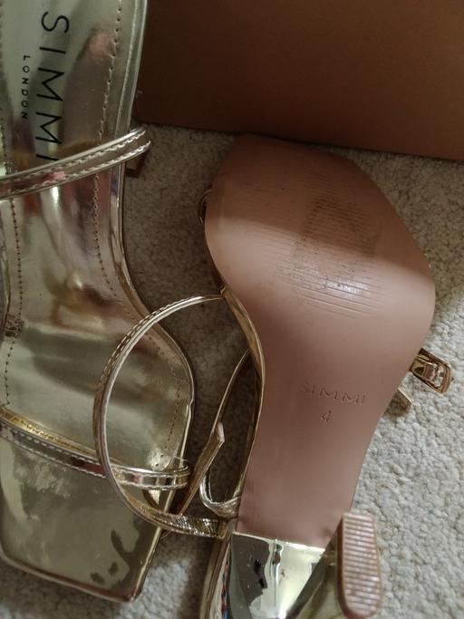  — gold heels
