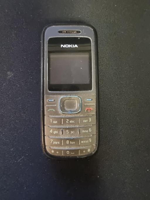  — Nokia 1208