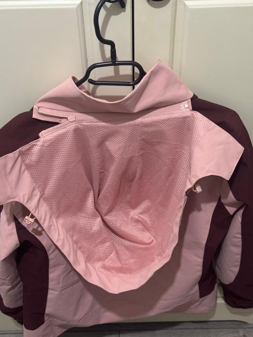  — woman pink windbreaker jacket