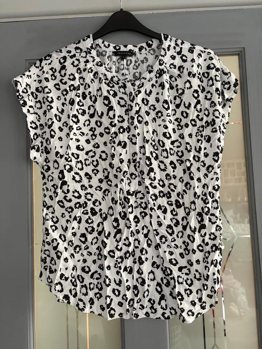  — Women’s top size 12