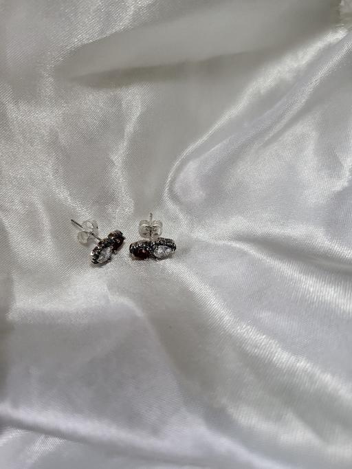  — Pandora Halo Hearts stud earrings feature a s