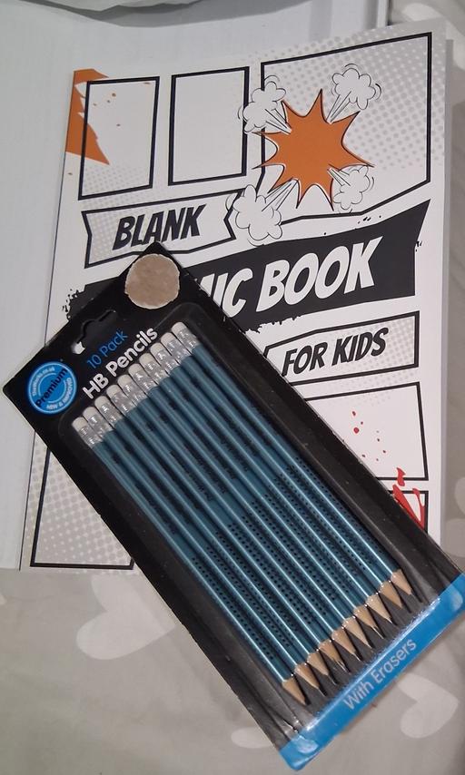  — blank comic book and pencils