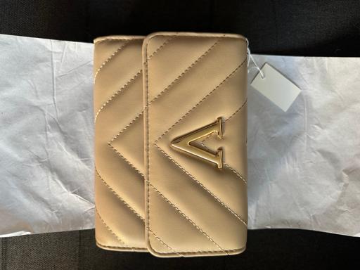  — Women’s brand new beige bag with with tags