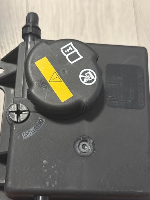  — power steering fluid reservoir