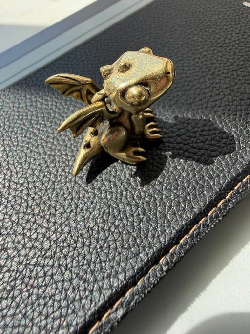  — Cute little baby dragon with wings and claws